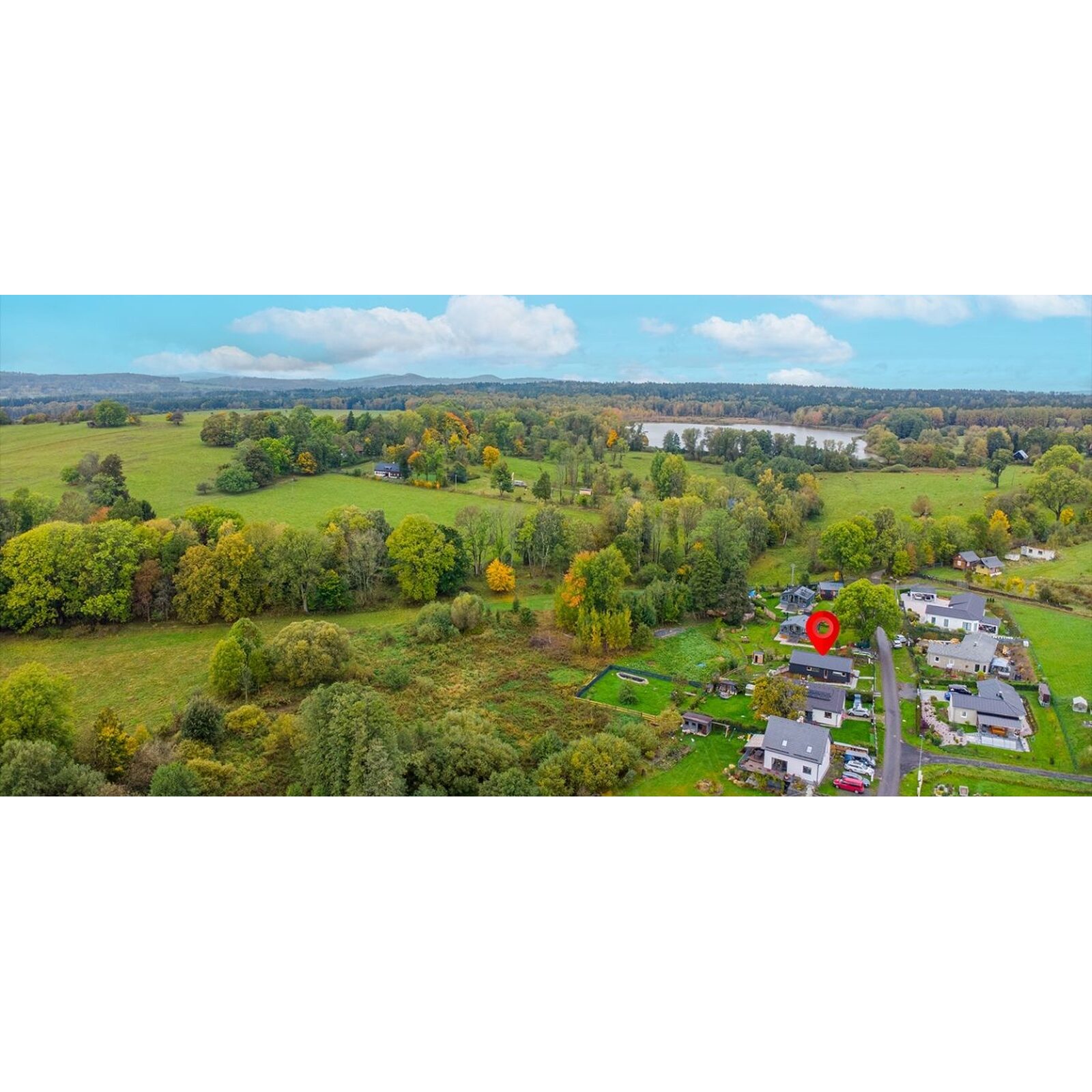 Aerial view of Horní Podluží and the surrounding forest landscape near Dream House